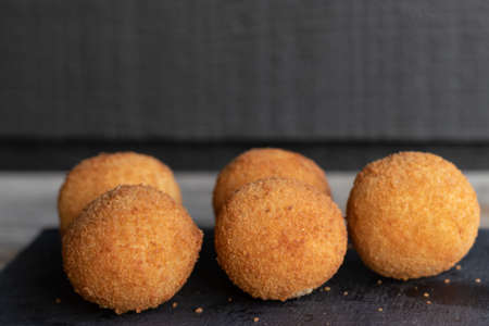 Bolinhas de queijo, a brazilian party finger food fried snack, stuffed with cheeseの写真素材