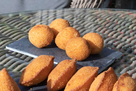 Salgados Brazilian fried snacks, party finger food fried snack, stuffed with chicken, cheese, cornの写真素材