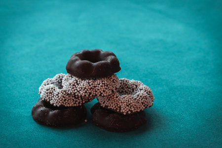 chocolate sweets on a green background table