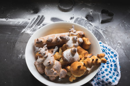 Kids activity with bread dough, baked snowman and other figuresの写真素材