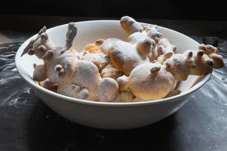 Kids activity with bread dough, baked snowman and other figuresの写真素材