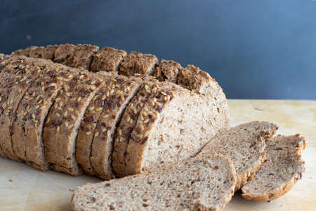 Bread with seeds on a wooden board