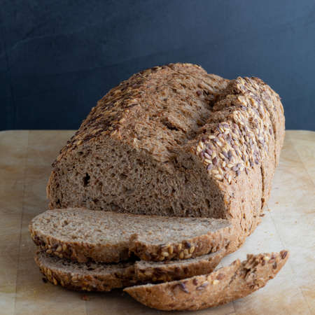 Bread with seeds on a wooden board