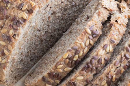 Bread with seeds on a wooden board