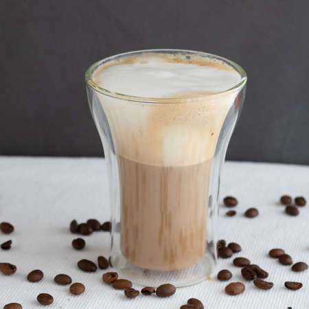 A double glass cup of cappuccinoの写真素材