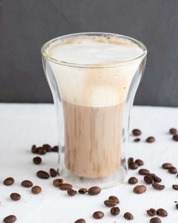 A double glass cup of cappuccinoの写真素材