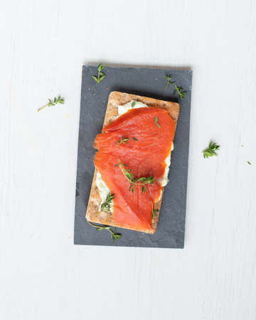 Wild Norwegian smoked Salmon on a crackerの写真素材