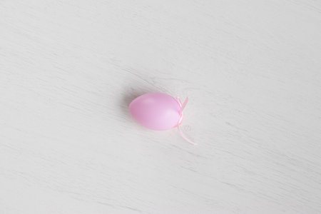 Pastel color plastic Easter eggs decoration on a light backgroundの写真素材