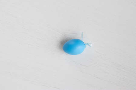 Pastel color plastic Easter eggs decoration on a light backgroundの写真素材