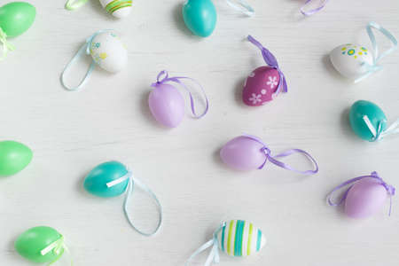 Pastel color plastic Easter eggs decoration on a light backgroundの写真素材