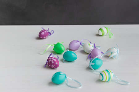 Pastel color plastic Easter eggs decoration on a light backgroundの写真素材