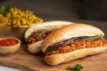 Indian Surinamese sandwiches filled with roti chicken curry, cod fish or tandoori chickenの写真素材