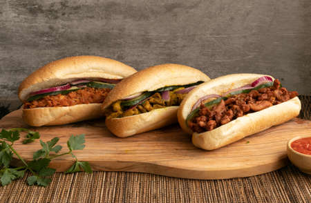 Indian Surinamese sandwiches filled with roti chicken curry, cod fish or tandoori chickenの写真素材