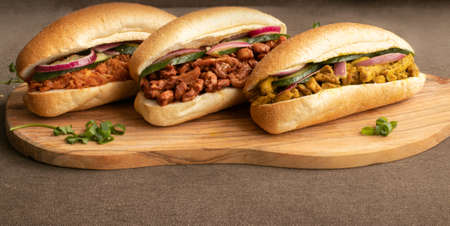 Indian Surinamese sandwiches filled with roti chicken curry, cod fish or tandoori chickenの写真素材