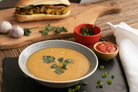 Dahl soup with yellow lentils on a table, lunch or dinningの写真素材