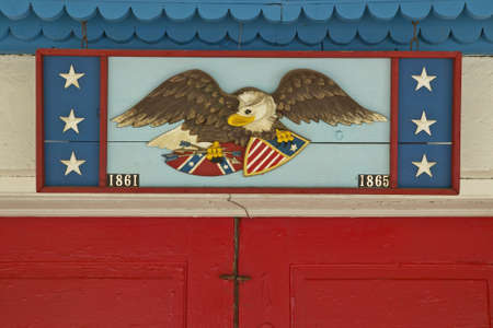 Antique Bald Eagle and American Flags at Andersonville, Georgia historic areaのeditorial素材