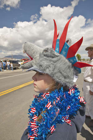 Child wearing unusual headgear for the Fourth of July Parade, in Lima Montanaのeditorial素材