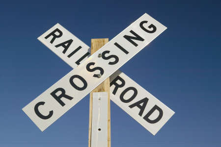 Railroad crossing sign and intersection in Mojave Desert of Southern Californiaの写真素材