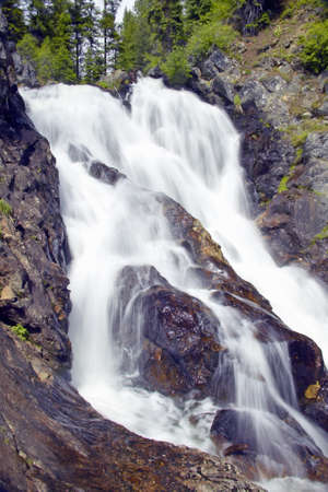 Running water and water fall runs through Payette national Forest near McCall Idahoの写真素材