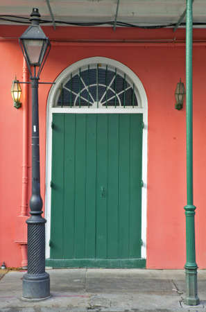 Old freshly painted doors in French Quarter near Bourbon Street in New Orleans, Louisianaの写真素材