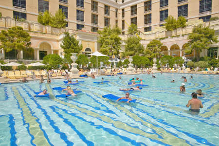 Large swimming pool with swimmers at Bellagio Casino in Las Vegas, NVのeditorial素材