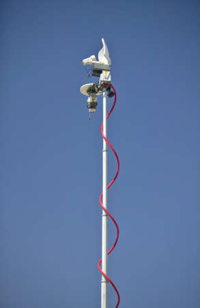 Satellite news delivery trucks sending TV signals to newsroomsの写真素材