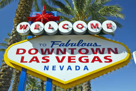 Colorful sign reads ÒWelcome to Fabulous Las Vegas, NevadaÓ in daytime with blue skyのeditorial素材