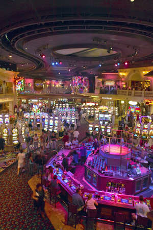 Rows of slot machines and gamblers at Rio Casino in Las Vegas, NVのeditorial素材