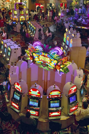 Rows of slot machines and gamblers at Rio Casino in Las Vegas, NVのeditorial素材
