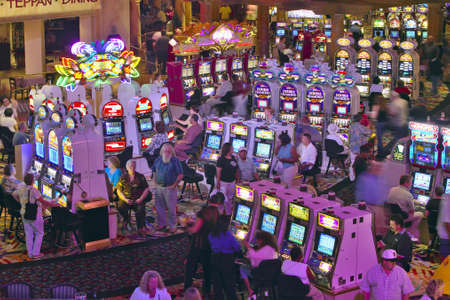 Rows of slot machines and gamblers at Rio Casino in Las Vegas, NVのeditorial素材