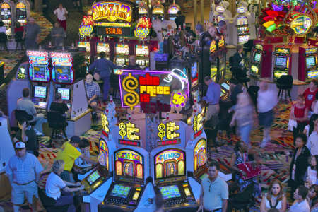 Rows of slot machines and gamblers at Rio Casino in Las Vegas, NVのeditorial素材