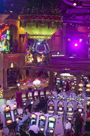 Rows of slot machines and gamblers at Rio Casino in Las Vegas, NVのeditorial素材