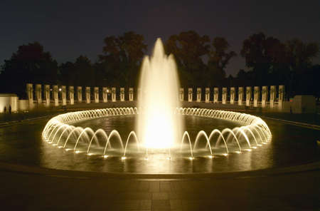 Fountains at the U.S. World War II Memorial commemorating World War II in Washington D.C. at duskのeditorial素材