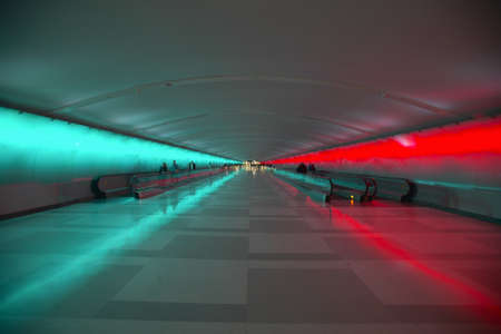 Moving sidewalks and a changing light show in the tunnel of the Detroit Airport, Detroit, Michigan