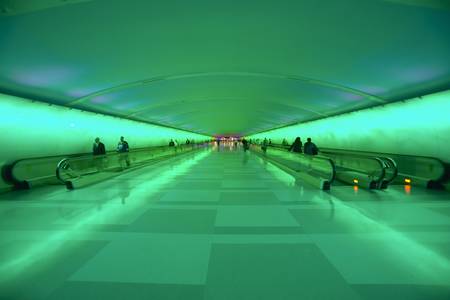 Moving sidewalks and a changing light show in the tunnel of the Detroit Airport, Detroit, Michiganのeditorial素材