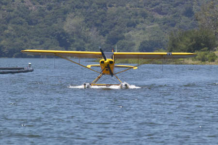 Yellow amphibious seaplane on Lake Casitas, Ojai, Californiaのeditorial素材