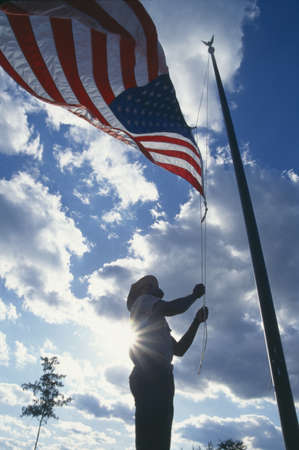 Man raising the American flag in New Gorge National Park, West Virginiaのeditorial素材