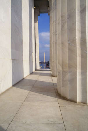View of the Washington Monument through the pillars of the Lincoln Memorial, Washington D.C.