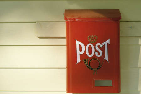 Red post office box on white wood board near Westfield, NYのeditorial素材
