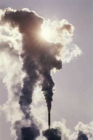Steam spewing into the sky from a utility power plantのeditorial素材