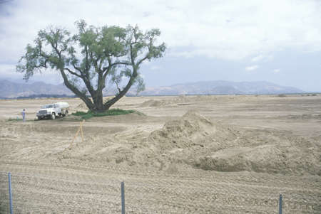 A man and a truck in a land development area in Ventura, Californiaのeditorial素材