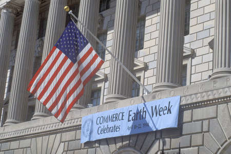 A sign indicating the celebration of Earth Week at The Department of Commerce in Washington, D.C.のeditorial素材