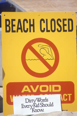 A sign reading ÒAvoid Water ContactÓ warning people that a beach at Marina del Rey, Los Angeles, CA, is closed due to pollution のeditorial素材