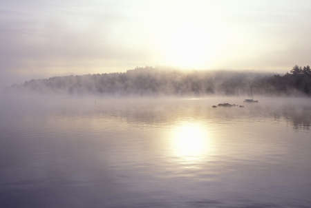 Lake Shrouded in Autumn Morning Fog, Squam Lake, New Hampshireのeditorial素材