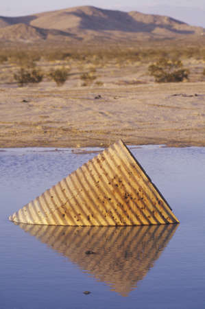 Old Piece of Metal in Water, Death Valley, Californiaのeditorial素材