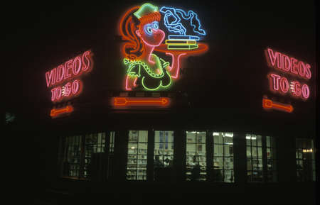 A neon sign that reads "Videos to Go"のeditorial素材