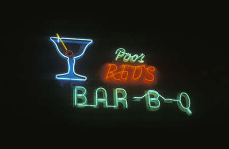 A neon sign that reads "Poor Red's Bar-B-Q"のeditorial素材