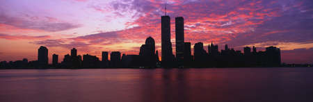 This is the Manhattan skyline from Jersey City, New Jersey at sunrise. The World Trade towers are in the center and the skyline is mostly in silhouette.の写真素材