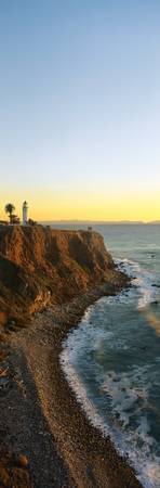 This is the Point Vicente Lighthouse at San Pedro Harbor. It shows the rocky coast line and beach.のeditorial素材