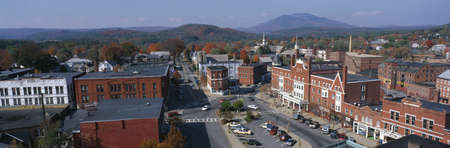This is a panorama view from the Bell Tower in Claremont. It shows a typical scene from small town America. The buildings are mostly made from red brick. We see fall foliage in the background.のeditorial素材